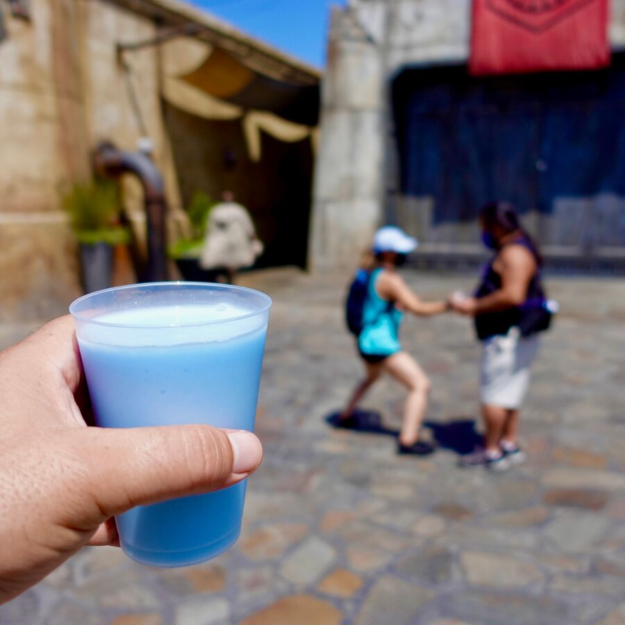 Blue milk drink resting on a table at Galaxy's Edge