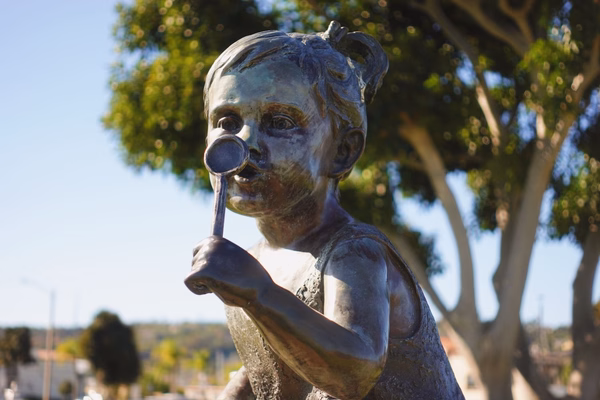 Statue of a girl blowing bubbles at Harbor Island